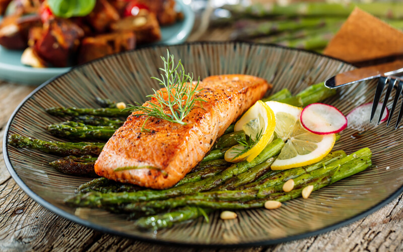 Salmon on a bed of asparagus
