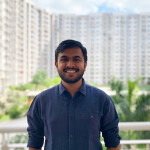 Ankit Alok Bagaria standing on a balcony with buildings in the background