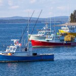 Lobster boats floating on the water in Bar Harbor, Maine