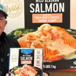 Keith Singleton holding up a box of the company's new salmon product