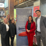 A delegation including Norwegian Fisheries Minister Marianne Sivertsen Næss (center right) toured a Whole Foods retail store in Boston, Massachusetts, U.S.A. on 15 March