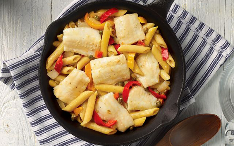 Mediterranean-Style Sole Pasta, which features wild-caught sole with penne pasta, roasted yellow and red peppers, and diced tomatoes in a lemon caper sauce