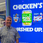 Aquamar CEO Daryl Gormley in front of a sign at Seafood Expo North America