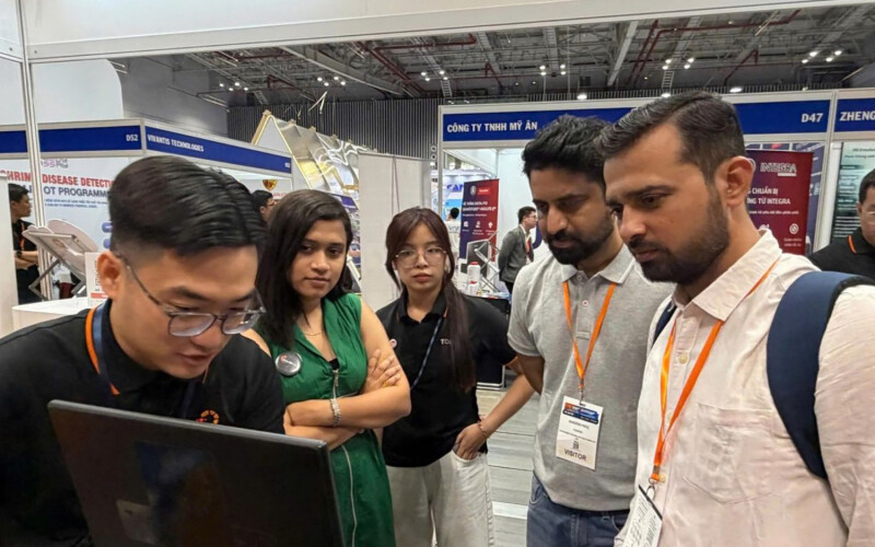 Otanics staff showing off the Tomota digital platform at the 2026 VietShrimp Asia and Aquaculture Vietnam show