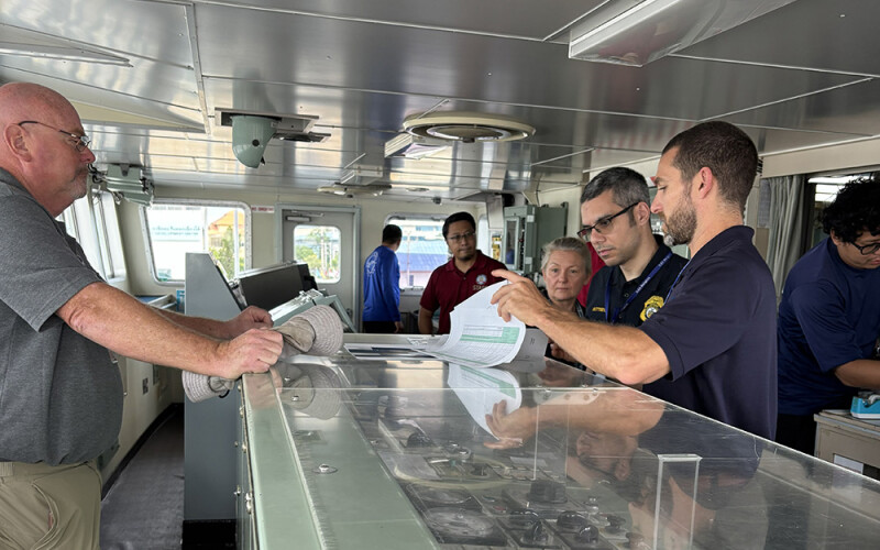 NOAA Fisheries instructors ahead of a mock boarding of a fishing vessel during a training in Bangkok, Thailand
