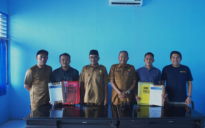 Fishers posing with their compensation packages
