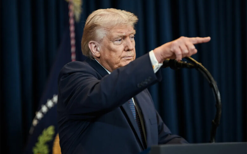 U.S. President Donald Trump pointing at a press conference