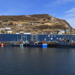 The exterior of a snow crab processing facility from the water