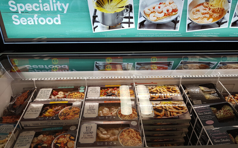 A refrigerated case of seafood products
