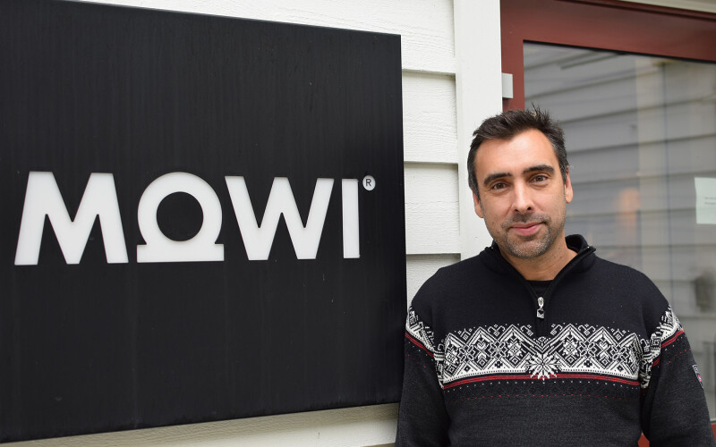 Matt Baranski of Mowi Genetics next to a Mowi sign