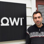 Matt Baranski of Mowi Genetics next to a Mowi sign