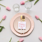 A plate with a Mother's Day card on it