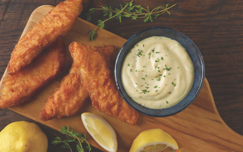 Fried whitefish on a cutting board