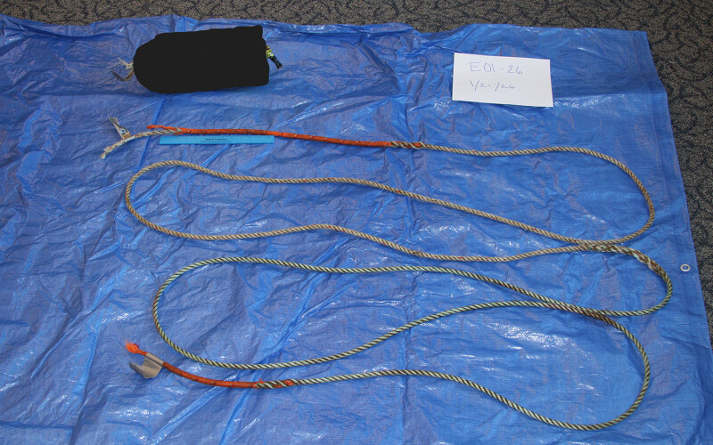 A piece of rope and a buoy on top of a tarp