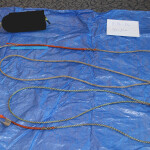 A piece of rope and a buoy on top of a tarp
