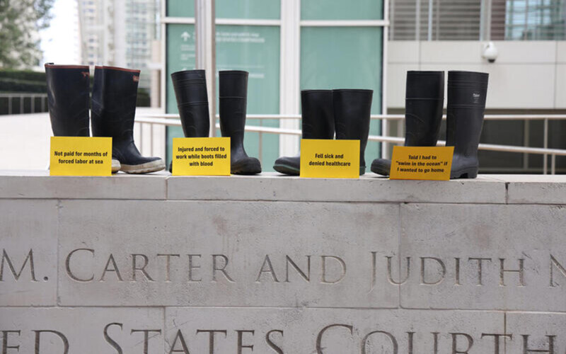 Fishing boots on top of a courthouse sign