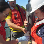 Researchers collect water samples for eDNA