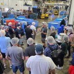 Scottish Fishermen’s Association members standing on a processing facility floor
