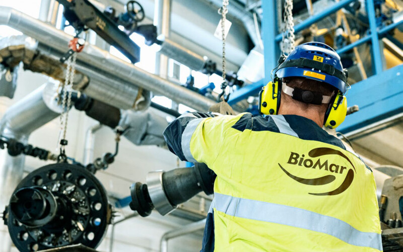 A worker for BioMar in a production facility