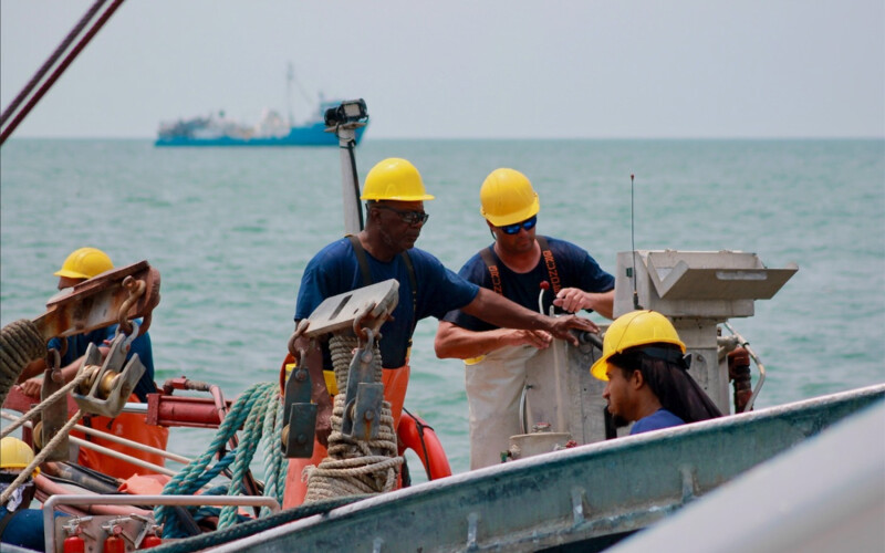 Workers with Ocean Harvesters on board a fishing vessel