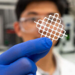 A NC State researcher holding up an example of the fluffy net