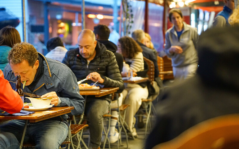 People in Bergen, Norway, eating at a seafood market