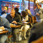 People in Bergen, Norway, eating at a seafood market