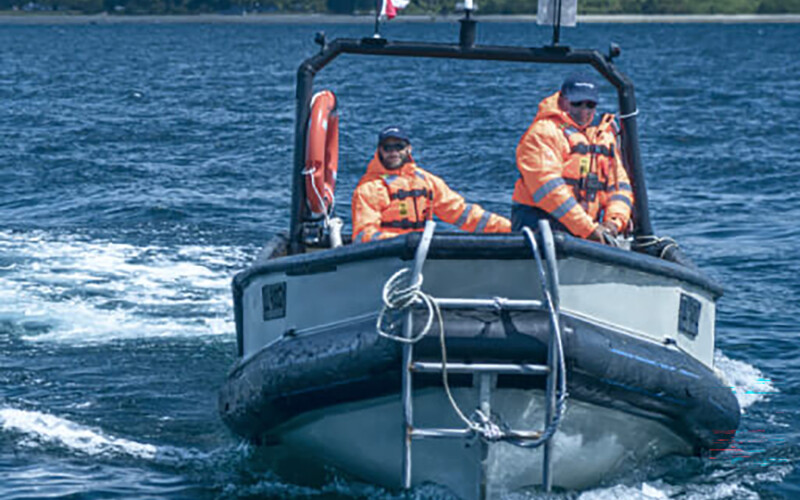 AquaChile employees on a boat