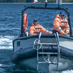 AquaChile employees on a boat