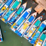 A top-down view of fishing boats in Indonesia