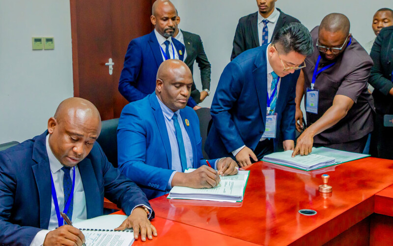 officials sign a contract for the vessels