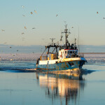 A fishing vessel in the Baltic Sea steaming toward a Latvia port