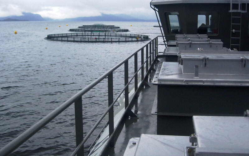 A AKVA Group vessel near some aquaculture net pens