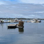 A harbor in Maine with two lobster boats