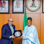 WorldFish Director General Essam Yassin Mohammed (left) and Nigeria’s Minister of Budget and Economic Planning, Senator Abubakar Atiku Bagudu, at the signing ceremony for the host country agreement in Abuja, Nigeria