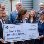 New York Governor Kathy Hochul presenting the check for the facility