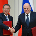 Chinese Premier Li Qiang and Russian Prime Minister Mikhail Mishustin shaking hands
