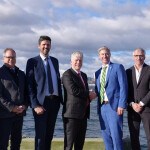 Canada Federal Energy Minister Tim Hodgson shaking hands during a funding announcement for offshore wind