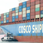 A Cosco shipping vessel at a port