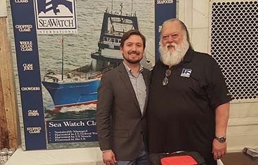 Sea Watch International Senior Vice President of Sales and Marketing Guy Simmons (right).