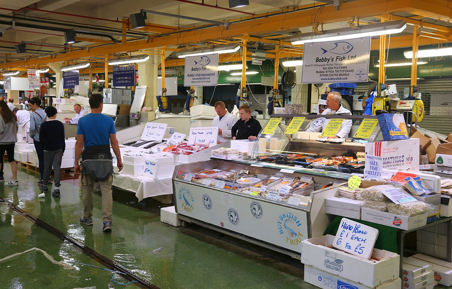 Vendors at the Billingsgate Fish Market in London selling locally produced seafood