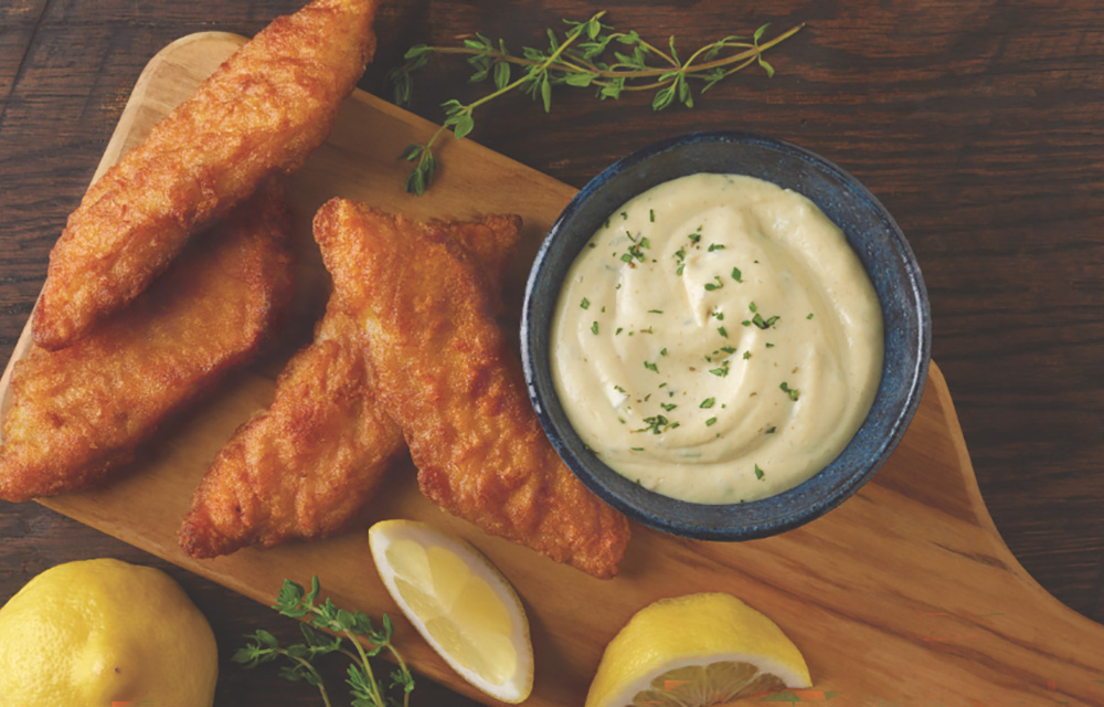 Fried whitefish on a cutting board