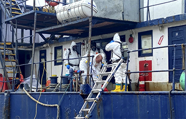 A cleanup crew on the Pacific Producer