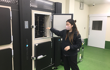 Hikari Iida of Iida Suisan shows off the company's new blast freezer.