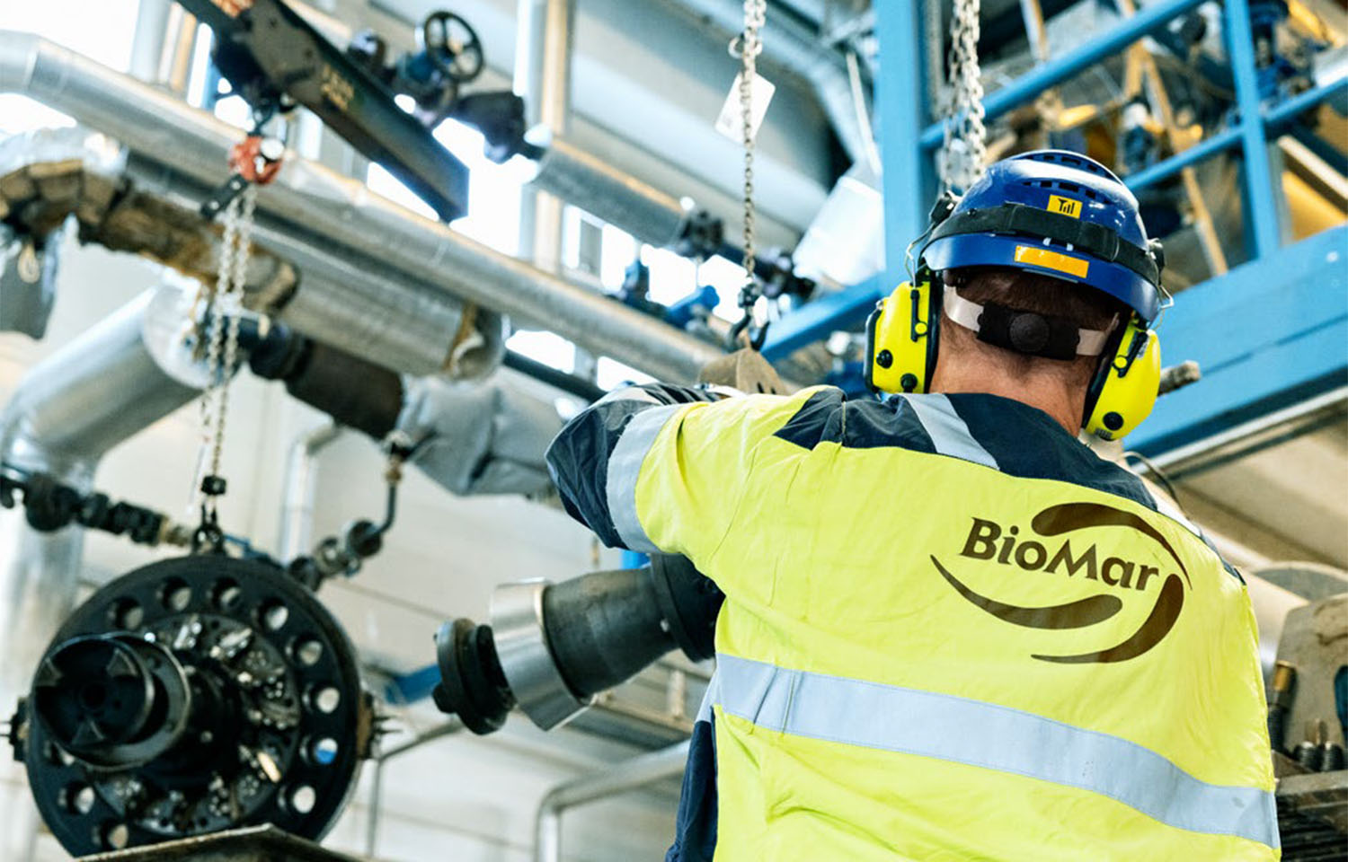 A worker for BioMar in a production facility