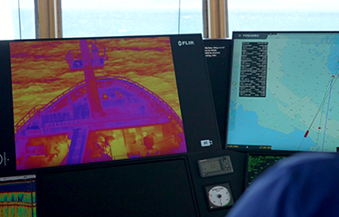 A display showing what a thermal camera is seeing in the helm of the Vikingur AK 100