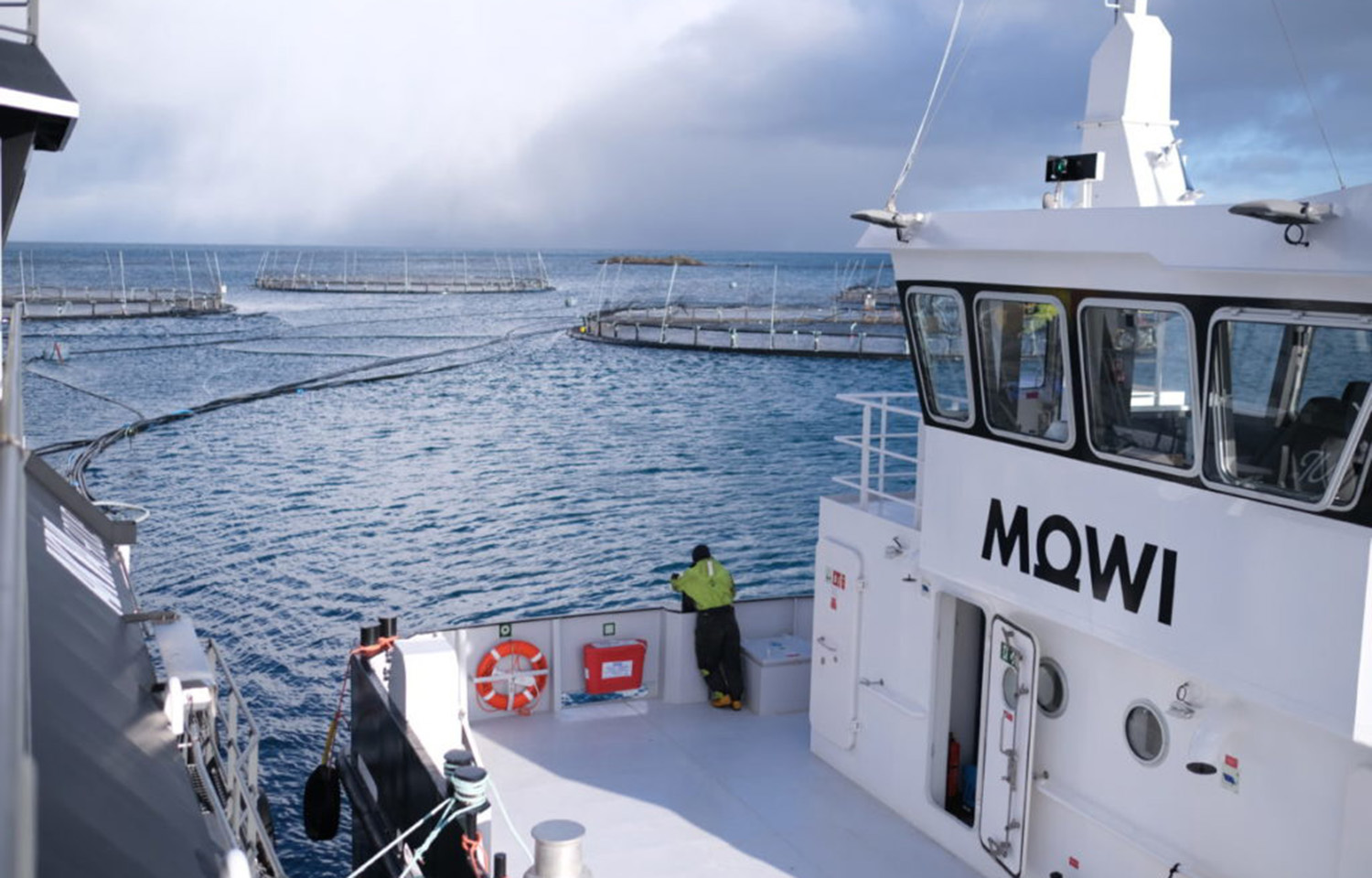 A Mowi wellboat tending to a salmon farm