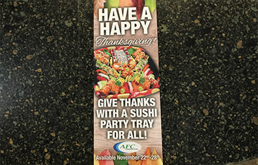 An advertisement for a Thanksgiving sushi platter from AFC.