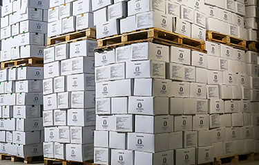 A stack of boxes filled with Oceanic Seafoods' products.