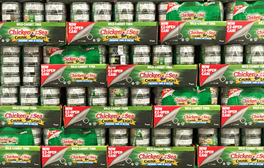 Chicken of the Sea tuna cans in a supermarket.